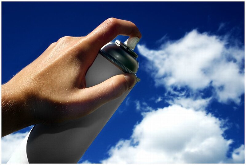 Hand Holding Spray Can — Blue