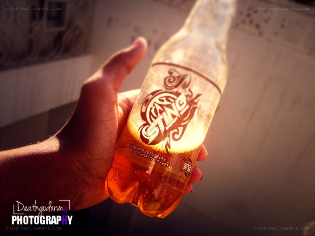 hand holding sting energy drink