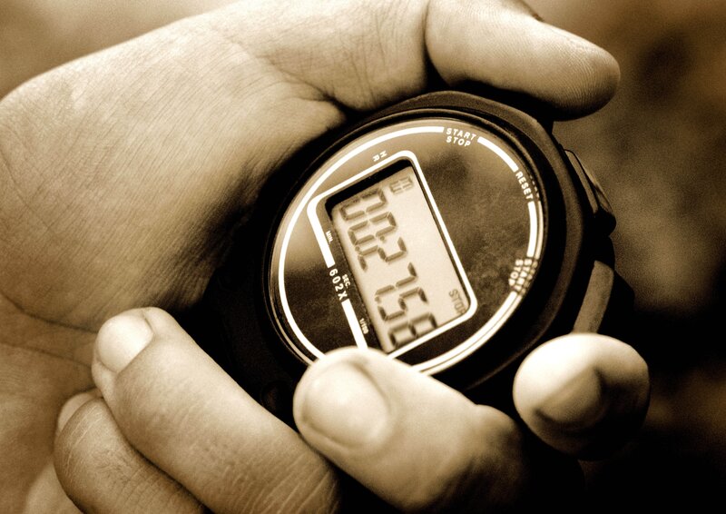 hand holding stopwatch