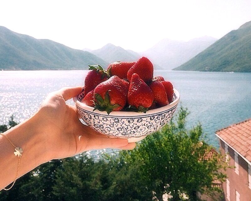 Hand Holding Strawberries — Red, Serene