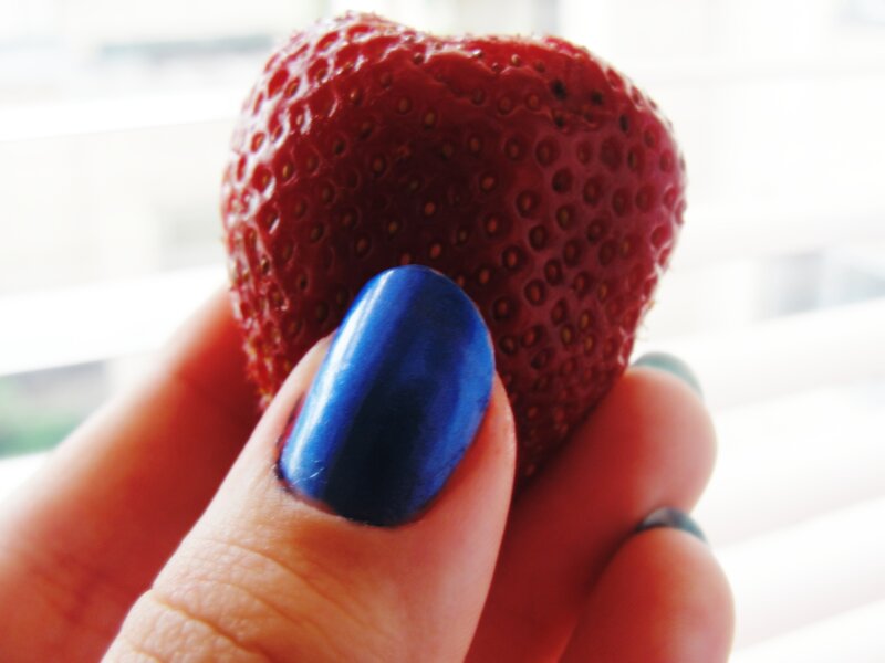 Hand Holding Strawberry