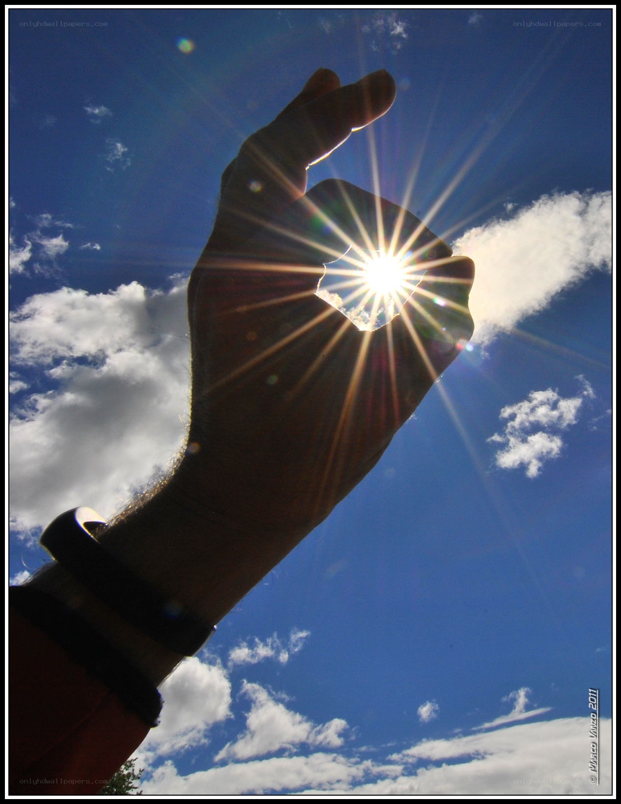 hand holding sunburst