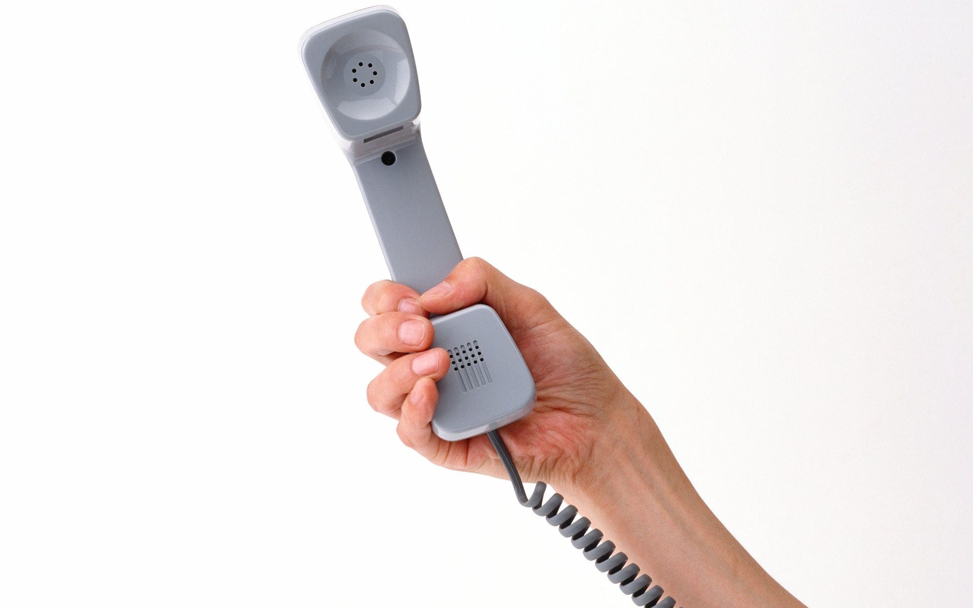 hand holding telephone receiver