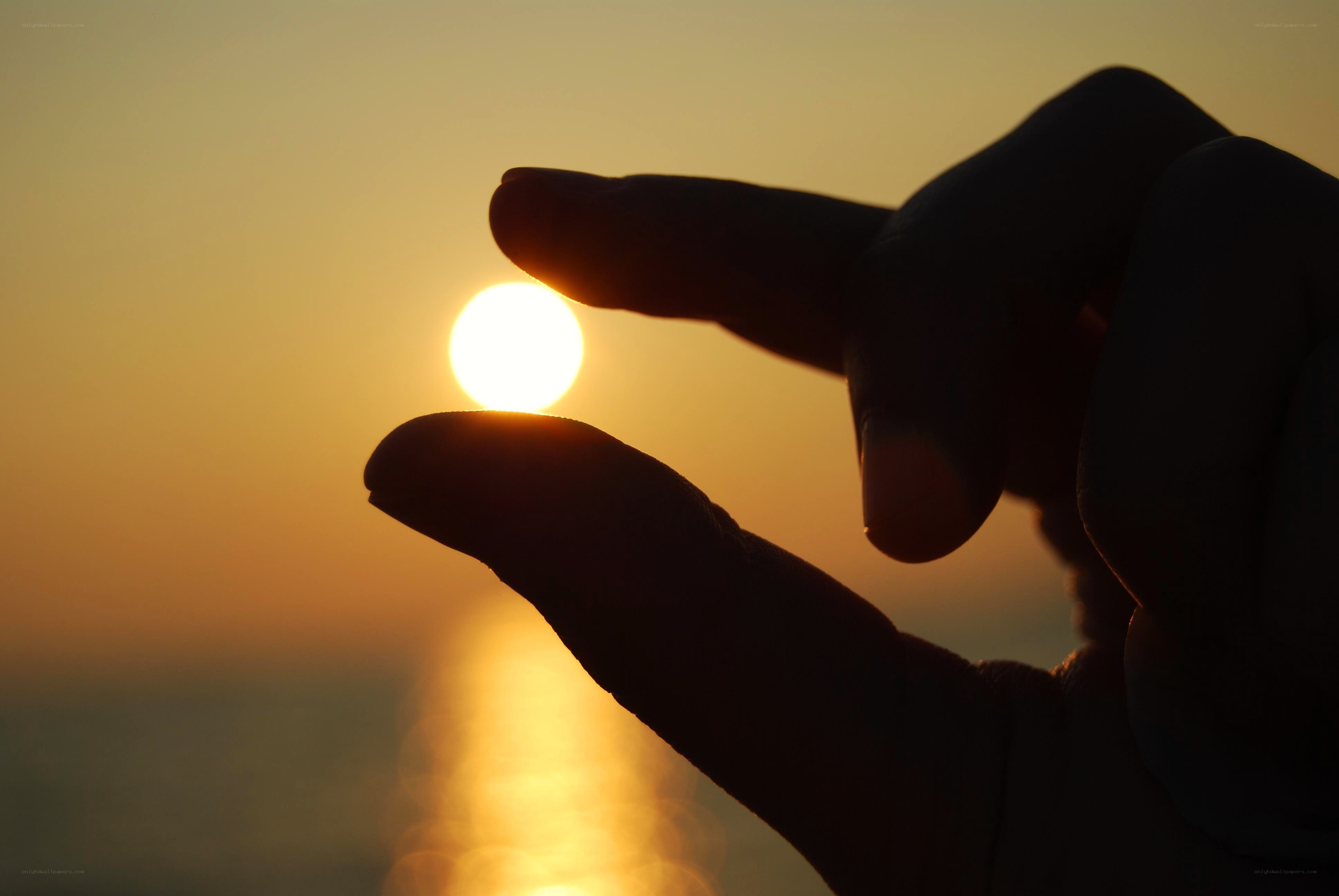 hand holding the sun