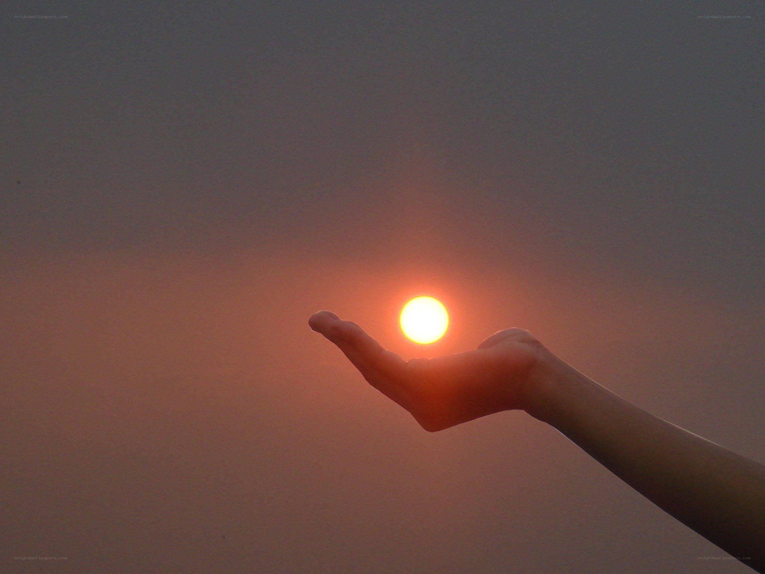 hand holding the sun
