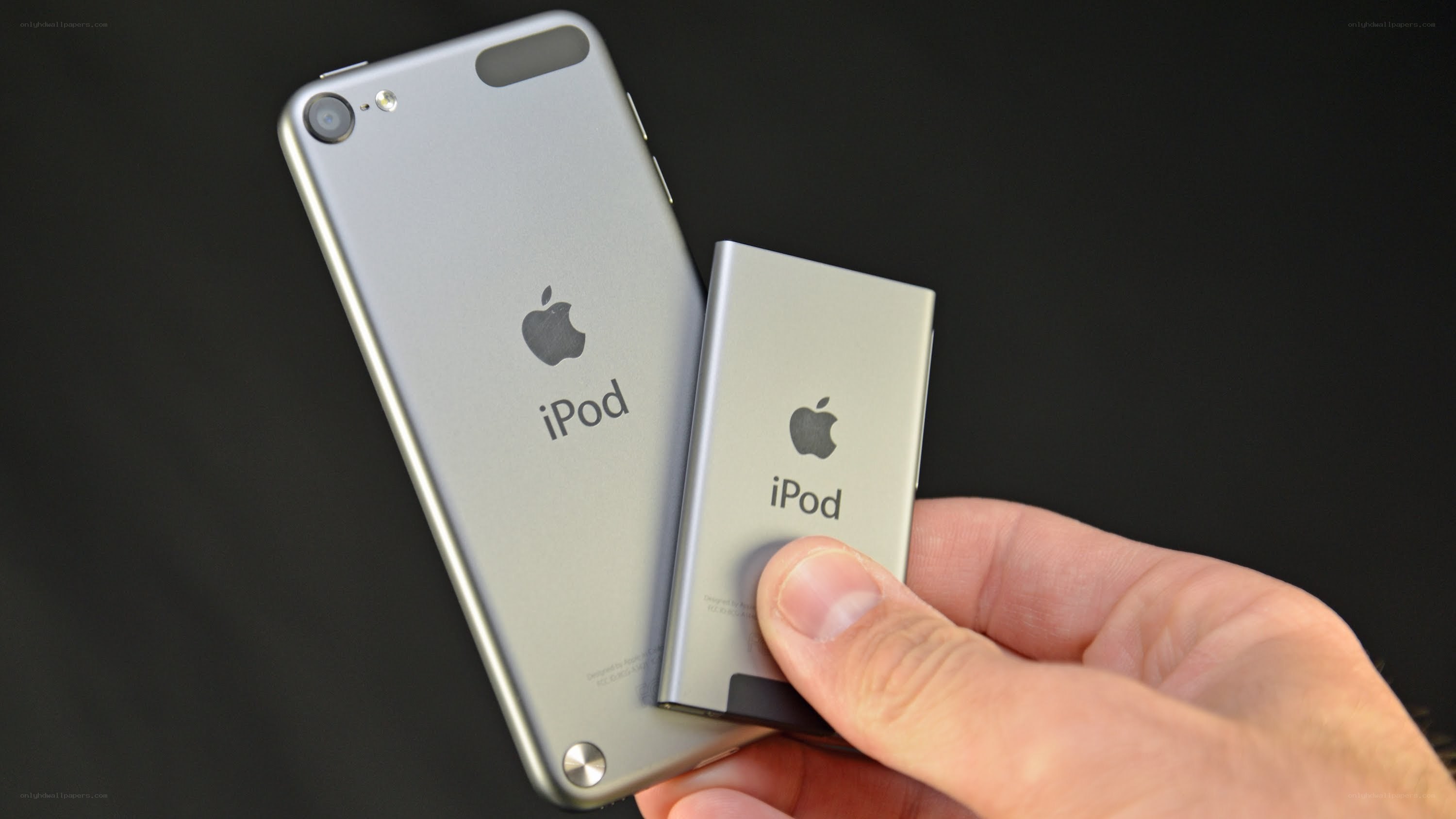 Hand holding two iPods