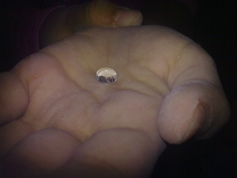Hand Holding Water Droplet — White