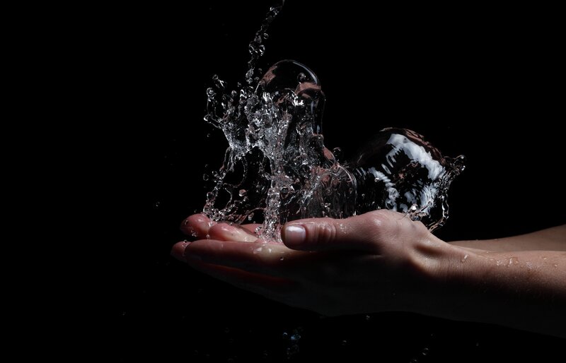 Hand Holding Water Splash