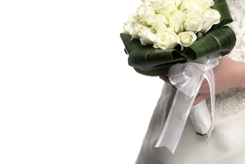 Hand Holding White Roses