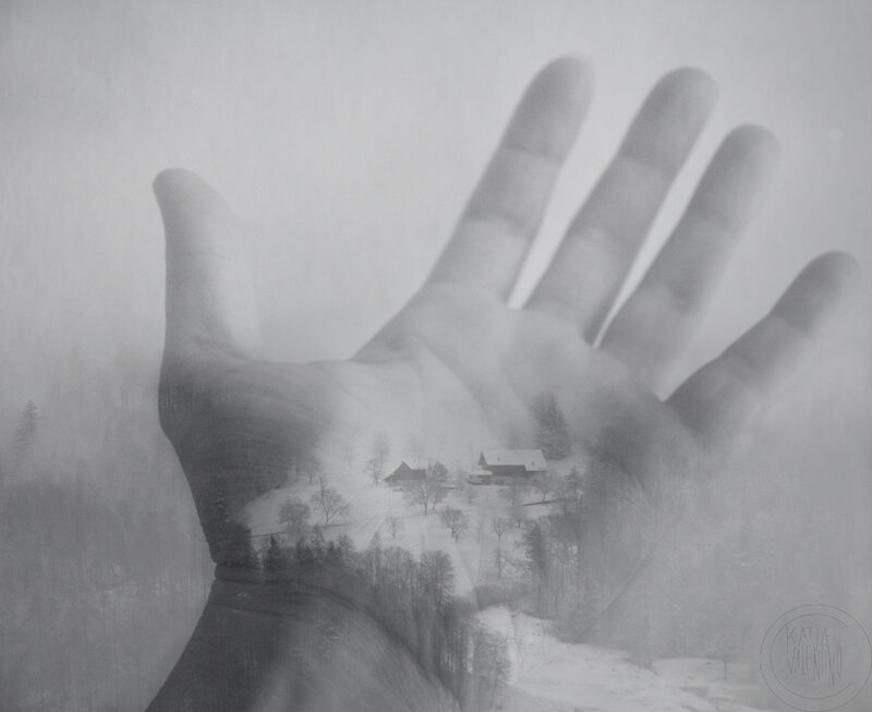 Hand Holding Winter Landscape