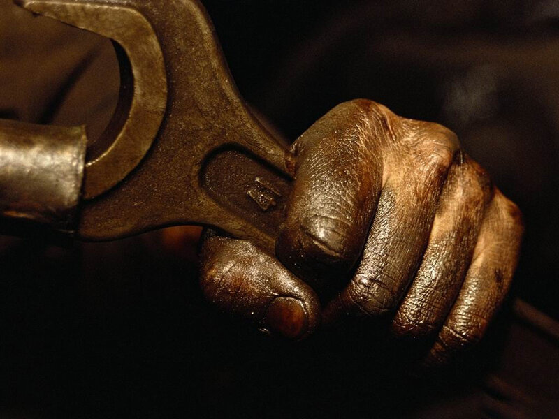 Hand Holding Wrench