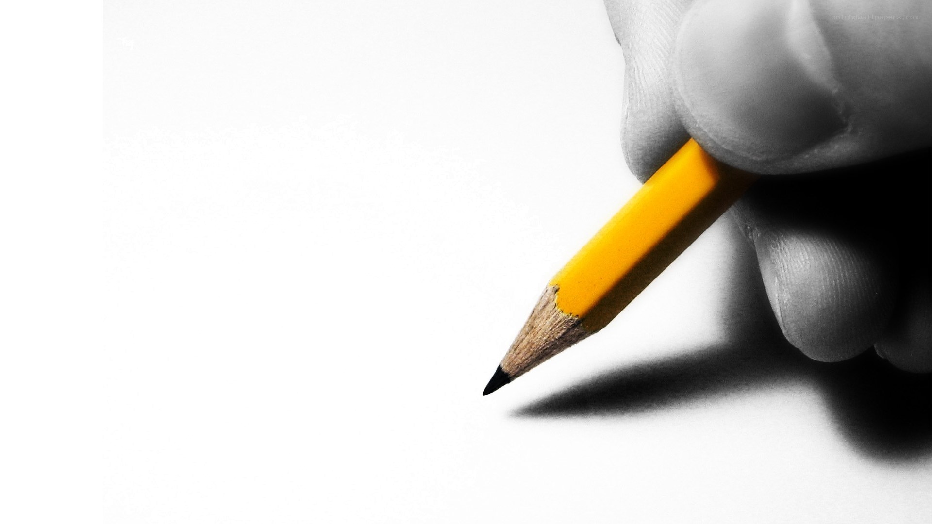hand holding yellow pencil