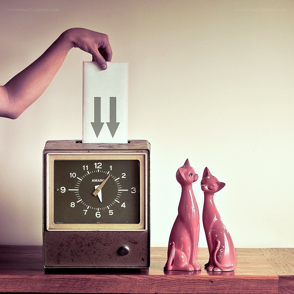 hand inserting paper into clock