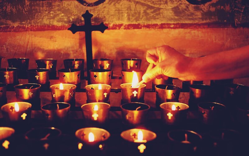 Hand Lighting a Candle — Orange