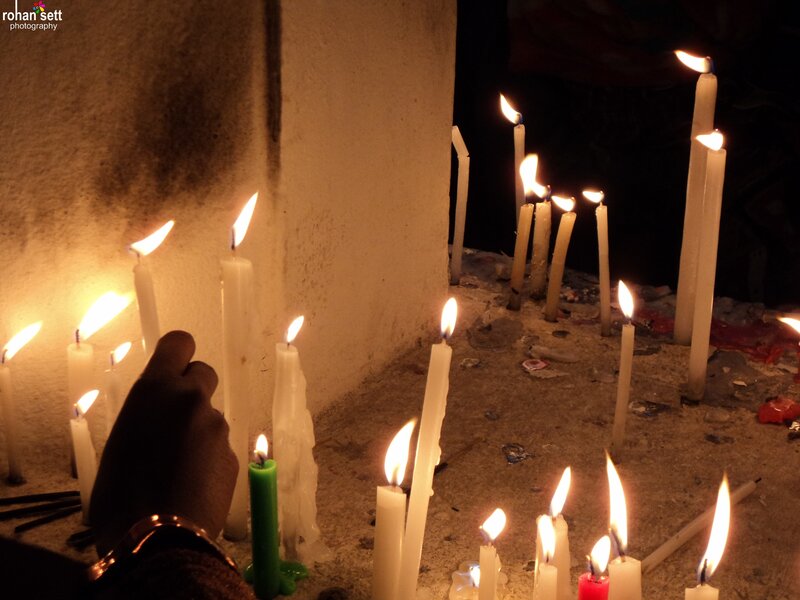Hand Lighting Candles