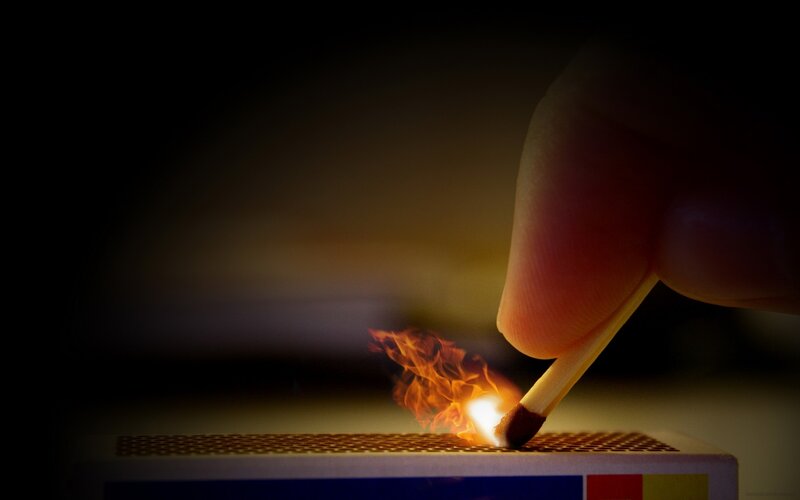 Hand Lighting Match — Black