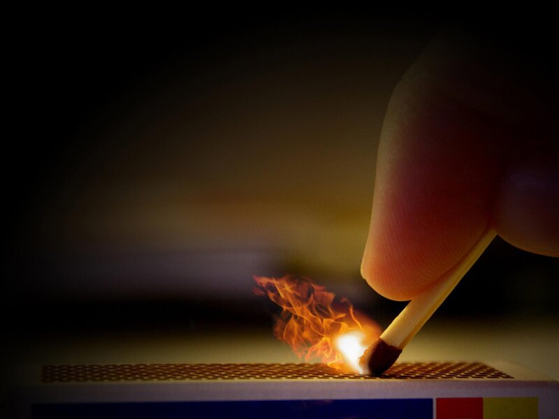 Hand Lighting Match — Orange, Dramatic, Night