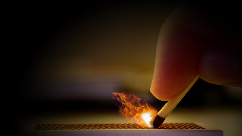 Hand Lighting Match — Orange