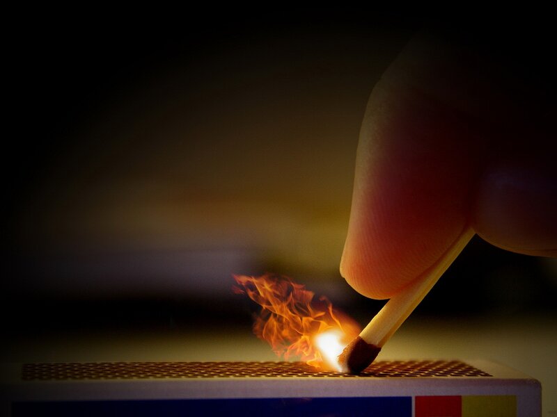 Hand Lighting Match