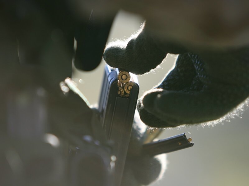 Hand loading a firearm magazine
