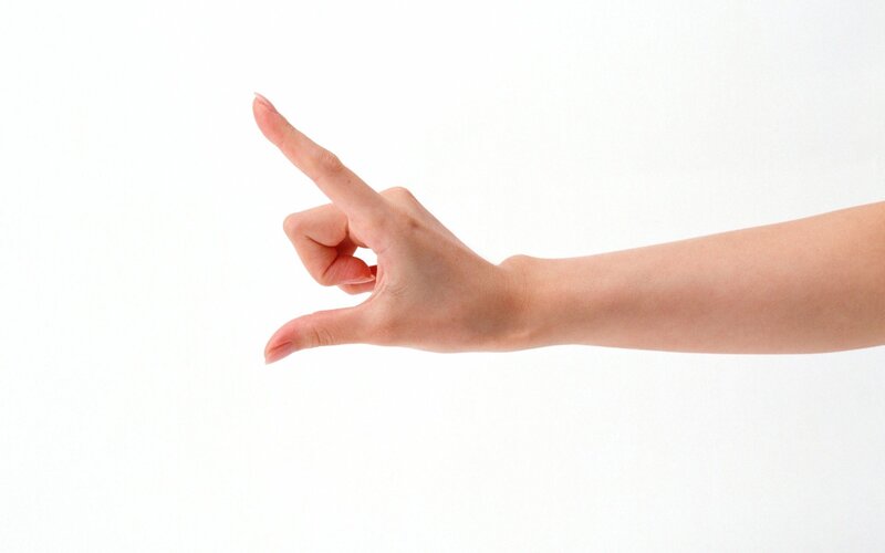 hand making pinching gesture