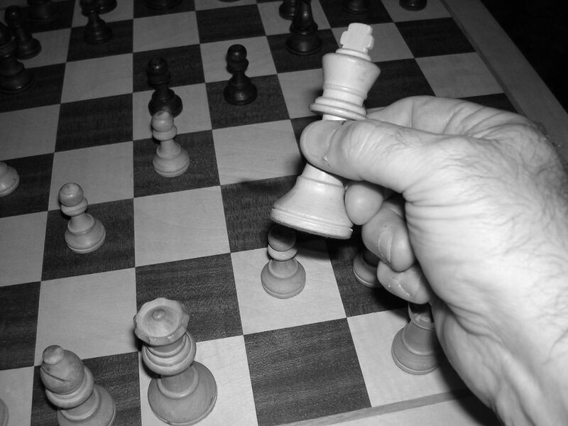 hand moving chess king