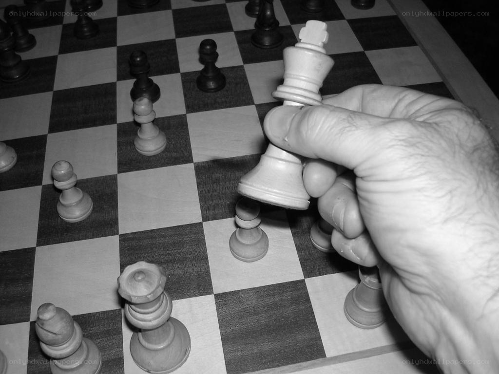 hand moving chess king
