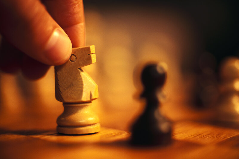 Hand moving chess knight