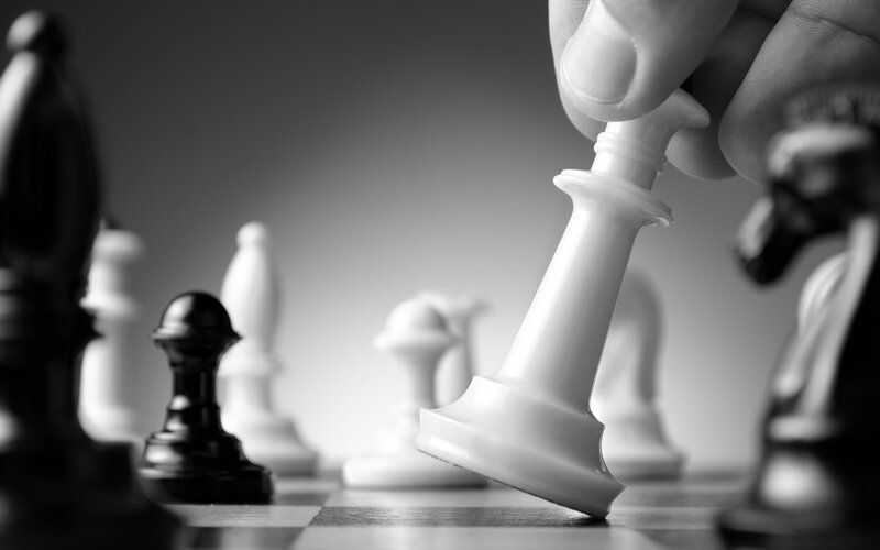 Hand Moving Chess Piece — Black