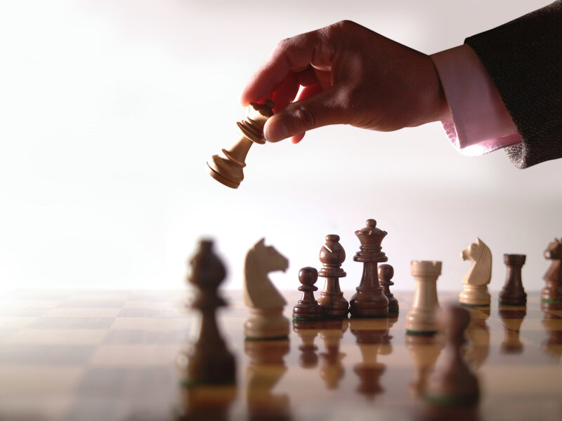 Hand Moving Chess Piece