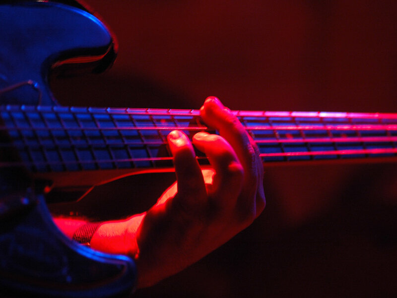 Hand on Bass Guitar
