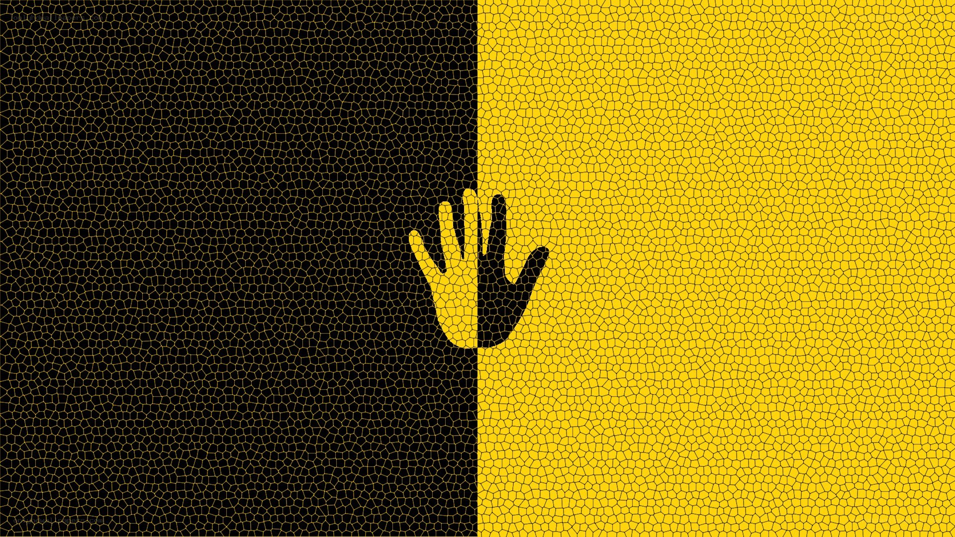 Hand on black and yellow background