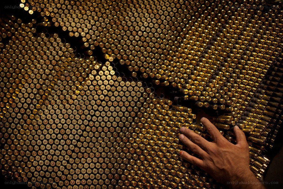 Hand on bullet art installation