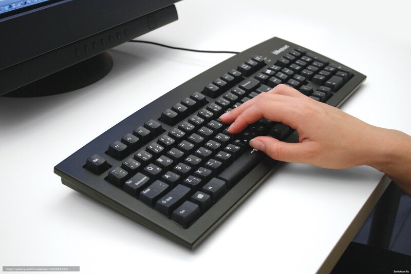 hand on computer keyboard