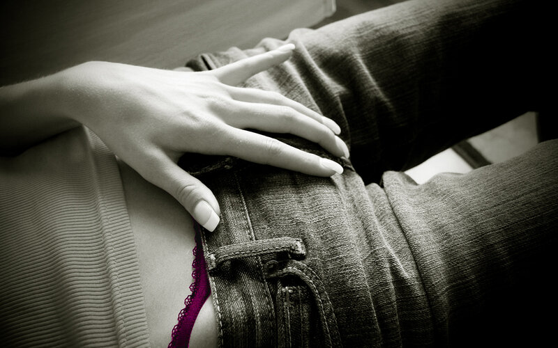 hand on denim fabric