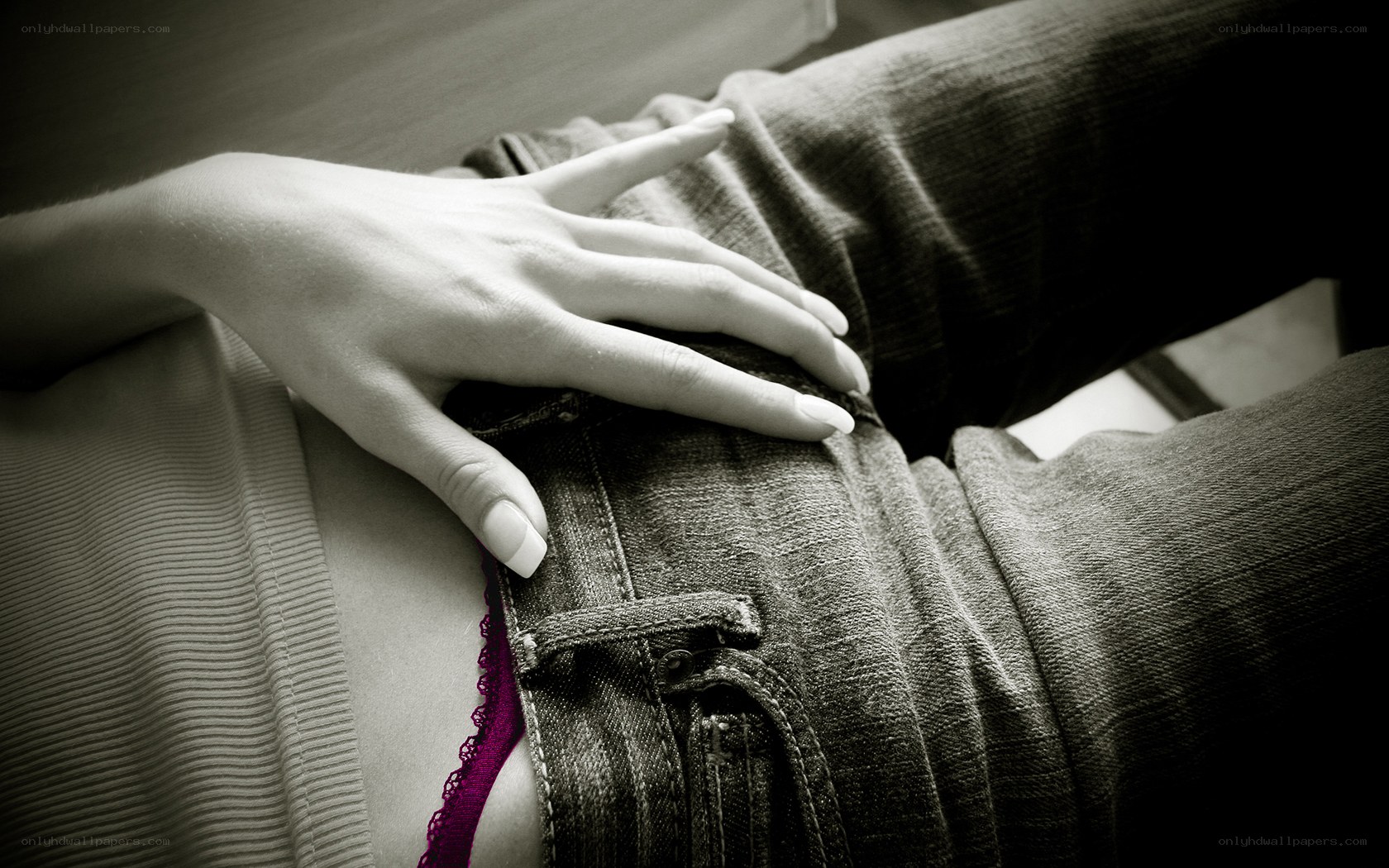 hand on denim fabric