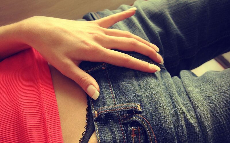 hand on denim pants