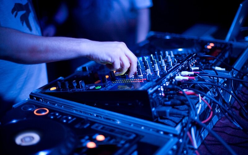 Hand on Dj Mixer — Blue