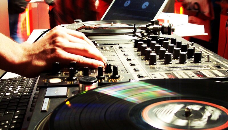 Hand on DJ Mixer