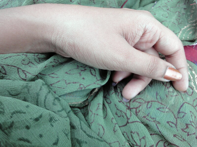 hand on green fabric