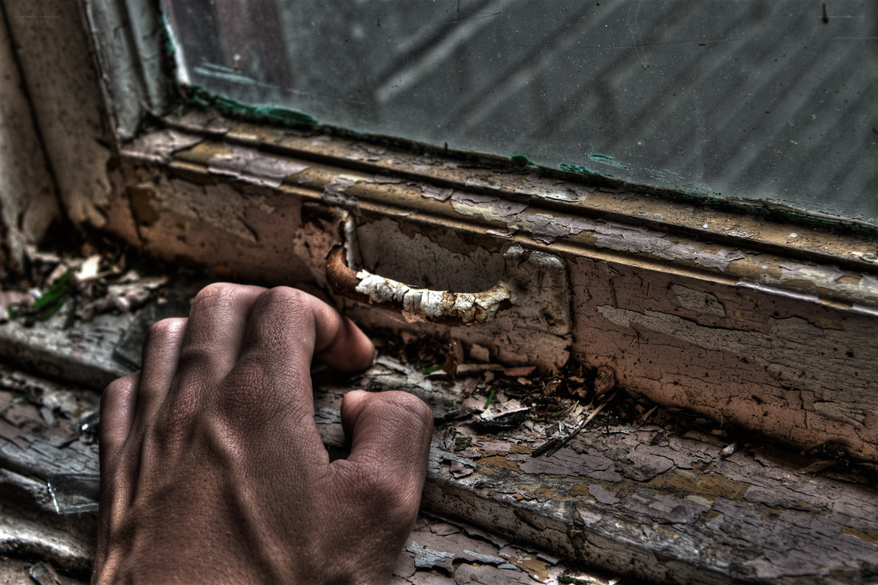hand on old window frame