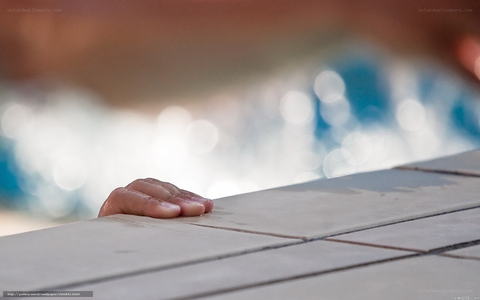 hand on pool edge