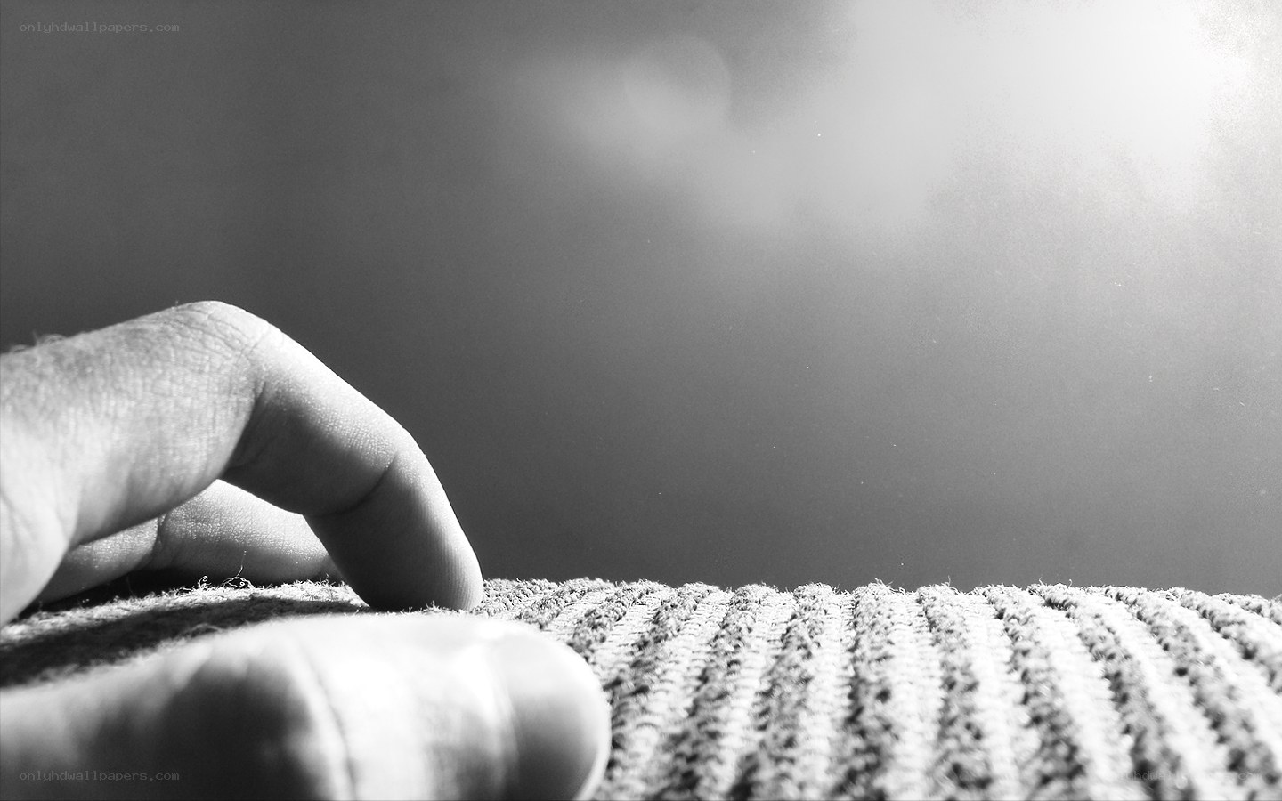 hand on textured fabric