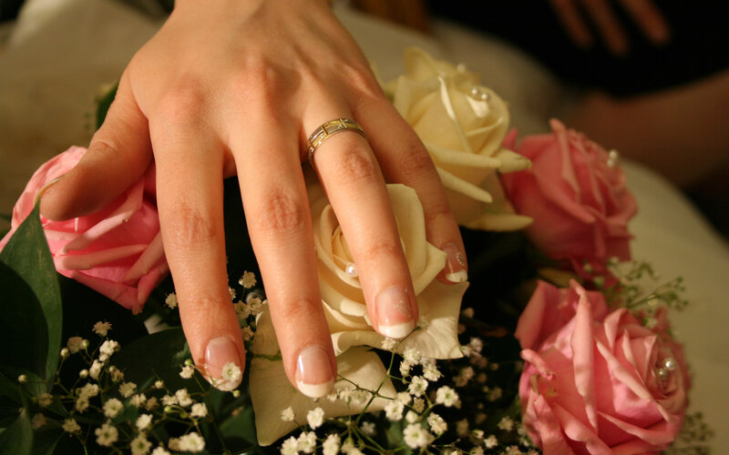 Hand on Wedding Bouquet
