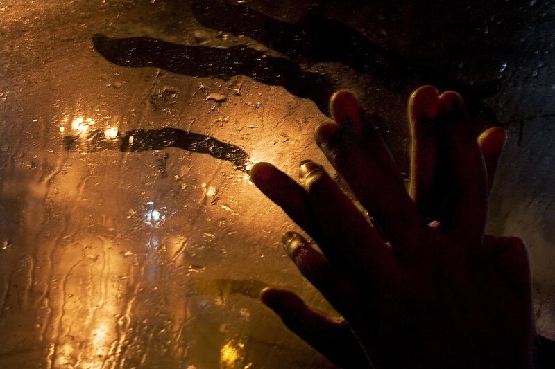 Hand on Wet Glass — Brown