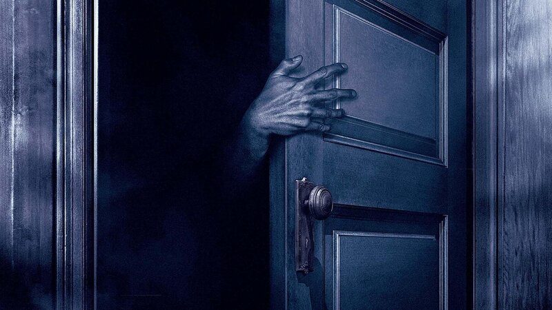 Hand on Wooden Door