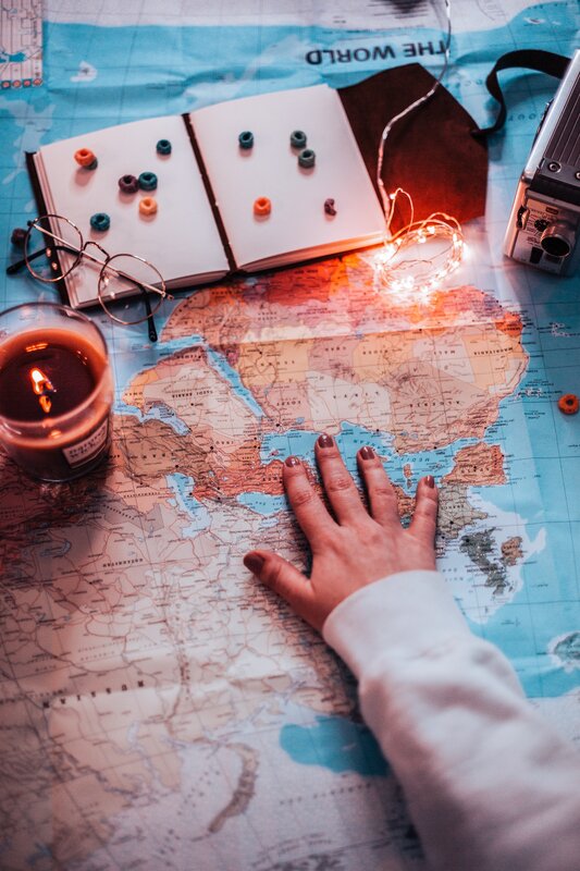 Hand on World Map