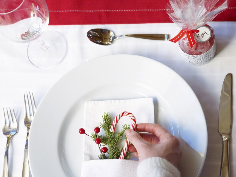 Hand Placing Candy Cane — White
