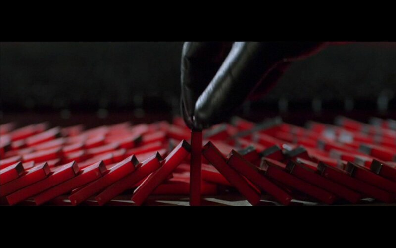 hand placing red block