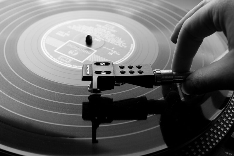 Hand Placing Turntable Needle — Black, Focused
